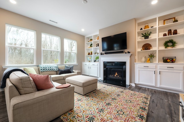 living%20room%20with%20three%20windows%20a%20white%20bookshelf%20and%20a%20linen%20couch a mortgage broker writing down interest rates on a whiteboard